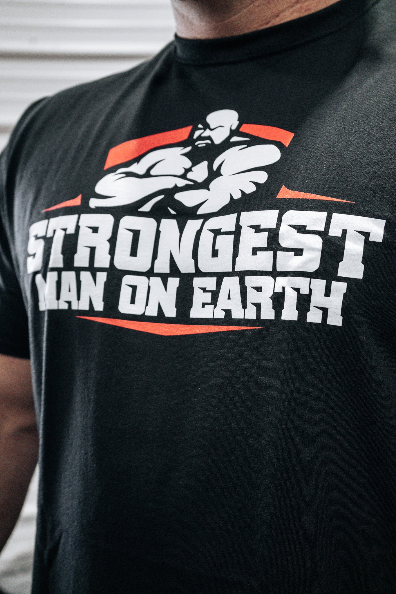 STRONGEST MAN ON EARTH RED T-SHIRT - ALL SALES FINAL