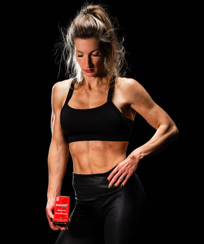 Keri Shaw holding Undefined Nutritions fat burning product instacut