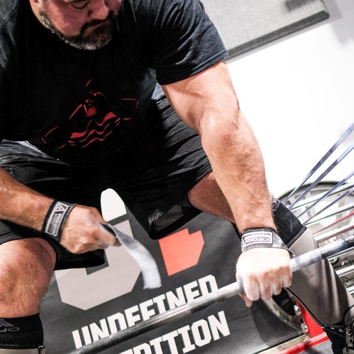 Brian Shaw lifting weights with a focus on fitness and strength training.