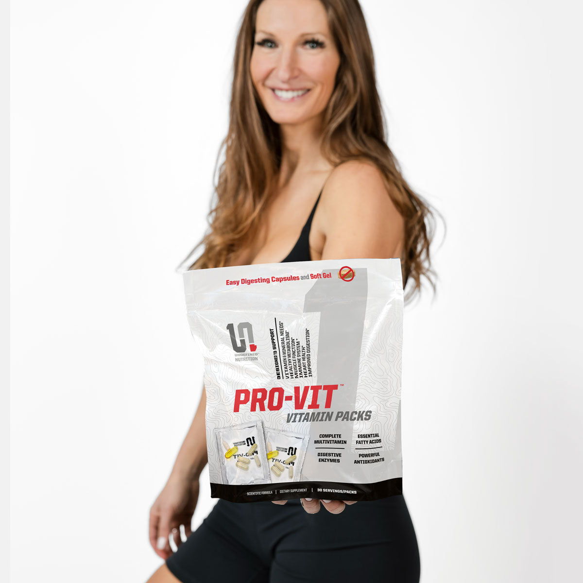 Keri Shaw holding a bag of Pro-Vit Vitamin Packs